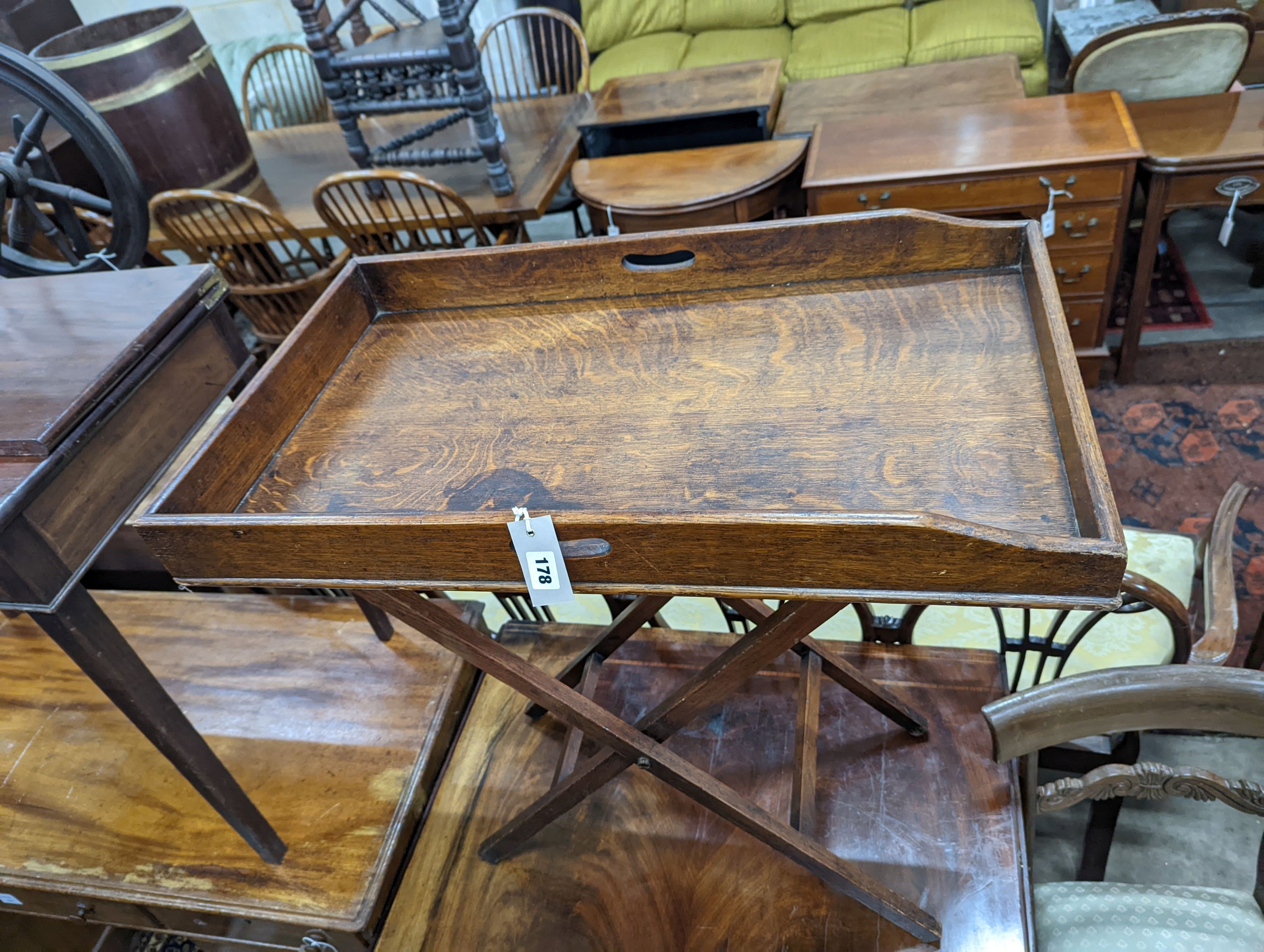 A Victorian rectangular oak butler's tray on folding stand, width 75cm, depth 44cm, height 80cm